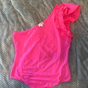 Bright pink onesie with one ruffle shoulder